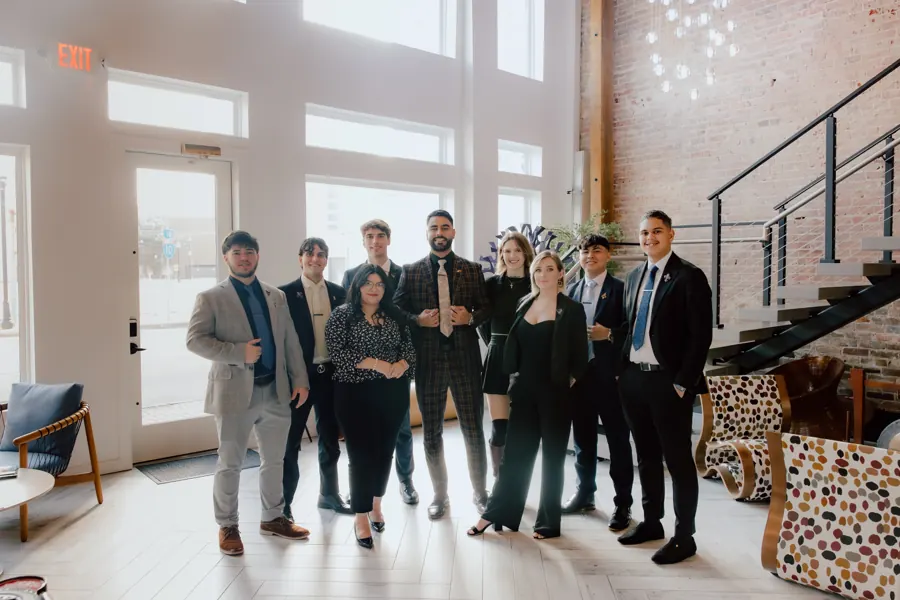 The Crescent team together in the office lobby